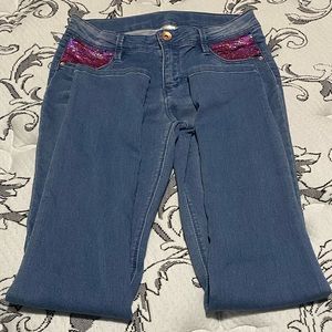 Sequins pocket skinny jeans with blue/pink sequins. Wore one time. Size 14/16 Y